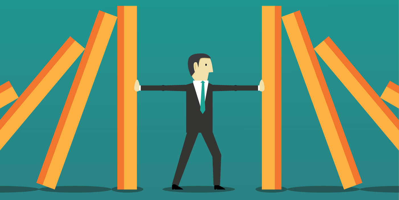 5 signs your business continuity plan wouldn’t stand up to scrutiny 1 Illustration of a businessperson in a suit standing between two falling rows of large orange and yellow dominoes, using both arms to stop them from collapsing. The image symbolizes resilience, prevention, and stability—representing how a strong business continuity plan helps organizations stop cascading failures during disruptions.